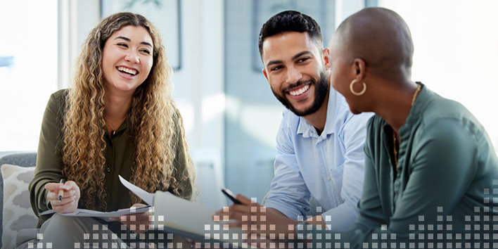 Three business people in discussion